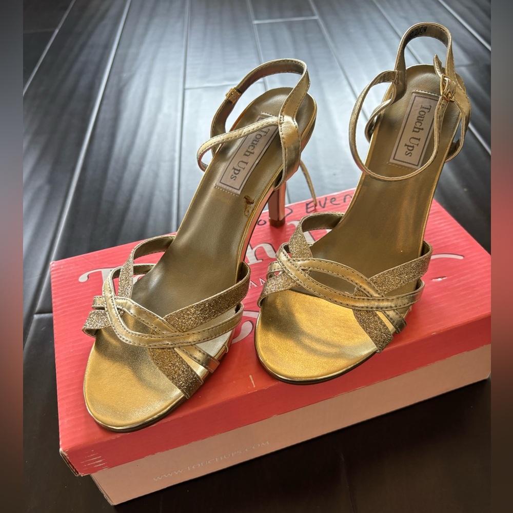 NWT - Touch up heels. Gold adjustable ankle strap. Never worn. 2.58 heel height.